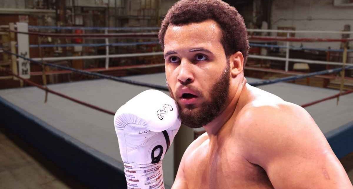 Boxer wearing gloves inside a boxing ring during a training session